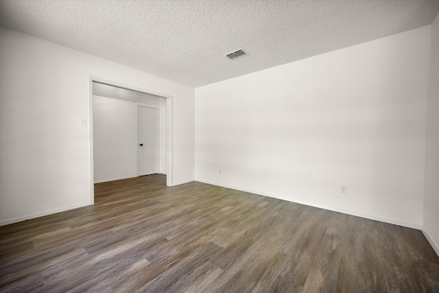 6516 Welch Ave, Fort Worth, TX 76133 - unfurnished bedroom featuring wood finished floors, a textured ceiling, baseboards, and a closet
