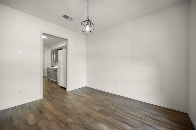 6516 Welch Ave, Fort Worth, TX 76133 - unfurnished dining area with dark wood-style flooring and baseboards
