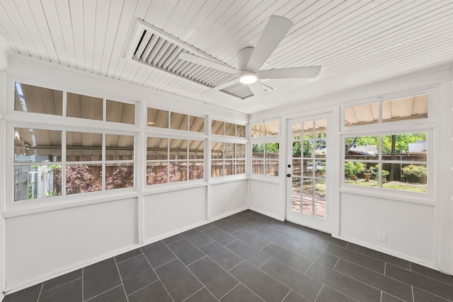 unfurnished sunroom with ceiling fan and a healthy amount of sunlight