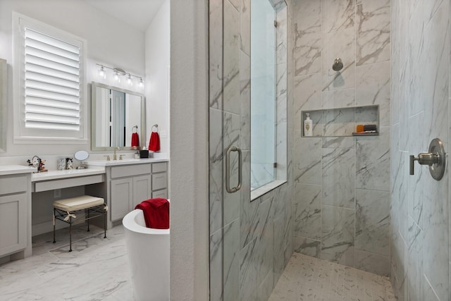 full bath with a soaking tub, marble finish floor, vanity, and a marble finish shower