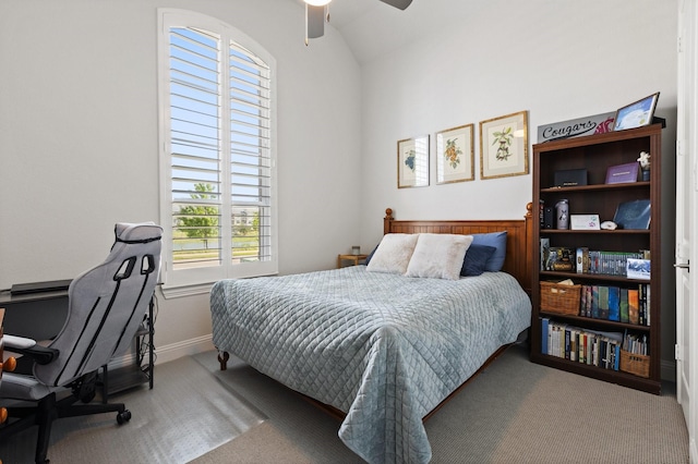 carpeted bedroom featuring ceiling fan and lofted ceiling
