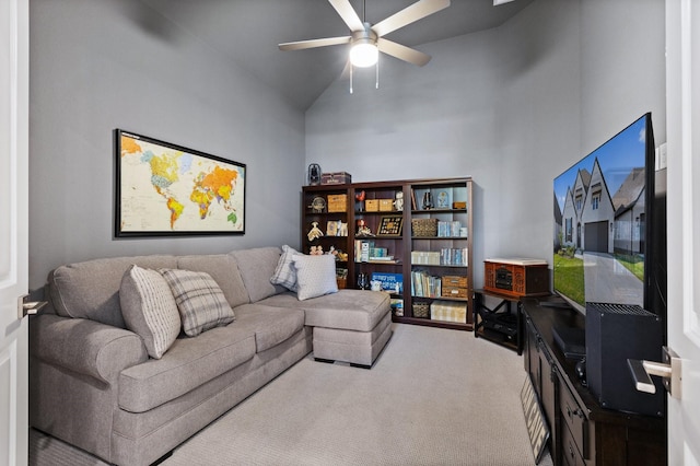 carpeted living room with high vaulted ceiling and ceiling fan