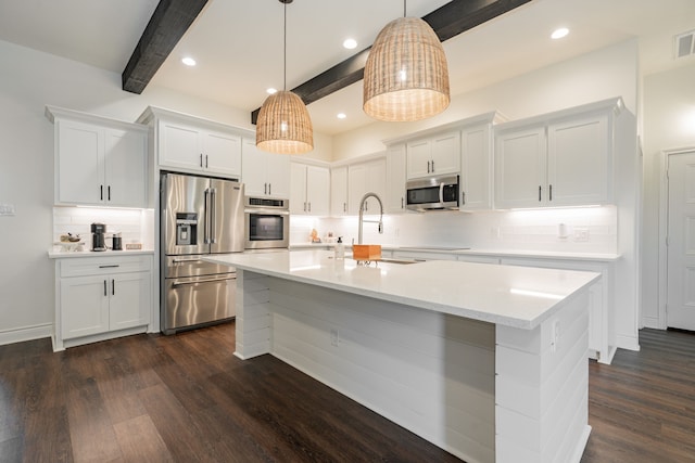 kitchen featuring a sink, beamed ceiling, dark wood-style floors, and stainless steel appliances