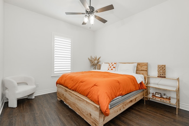 bedroom with wood finished floors, ceiling fan, and baseboards
