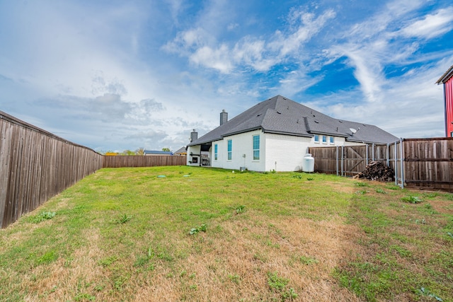 view of yard with a fenced backyard