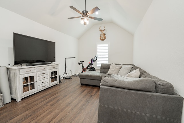 living area featuring lofted ceiling, ceiling fan, and dark wood finished floors