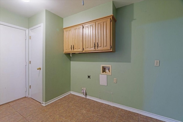 clothes washing area featuring baseboards, hookup for an electric dryer, washer hookup, and cabinet space