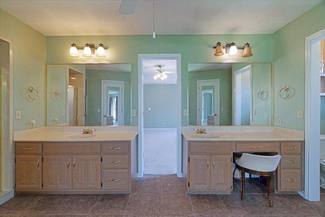 bathroom with two vanities, a sink, and a ceiling fan