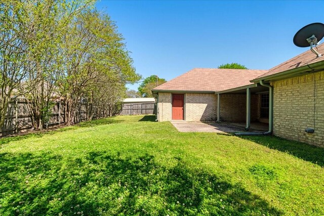 view of yard featuring a fenced backyard and a patio