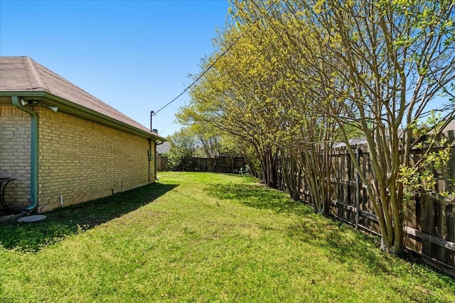 view of yard featuring a fenced backyard