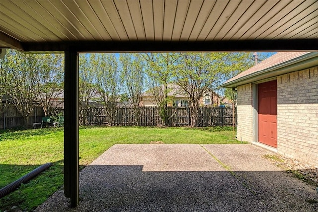 view of yard featuring a patio area and a fenced backyard