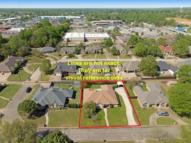 birds eye view of property with a residential view