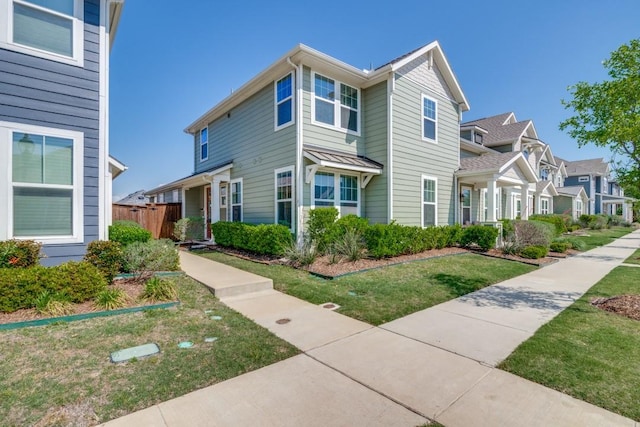 6441 Boone Dr, Rowlett, TX 75089 - view of front of home featuring fence, a front lawn, and a residential view