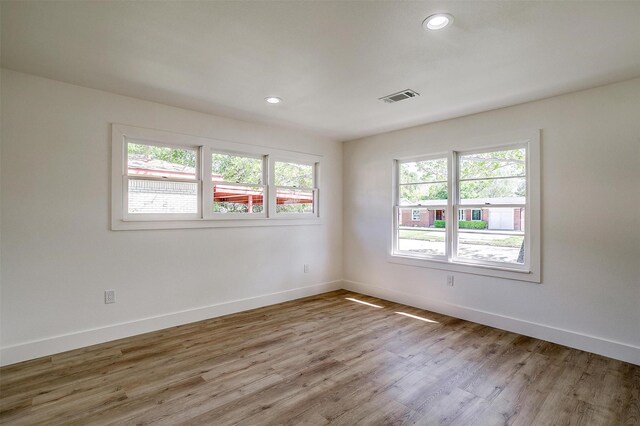 5440 Fursman Ave, Fort Worth, TX 76114 - unfurnished room featuring baseboards, wood finished floors, and visible vents
