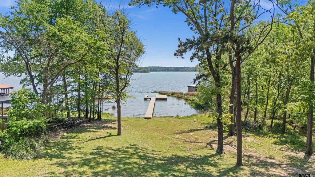 15185 Big Oak Bay Rd, Tyler, TX 75707 - view of yard with a dock and a water view