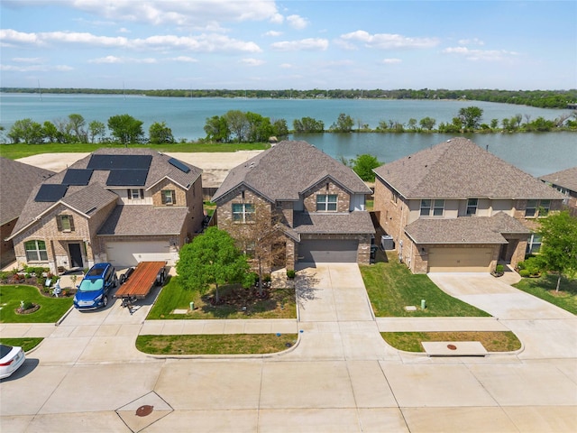 bird's eye view with a water view and a residential view
