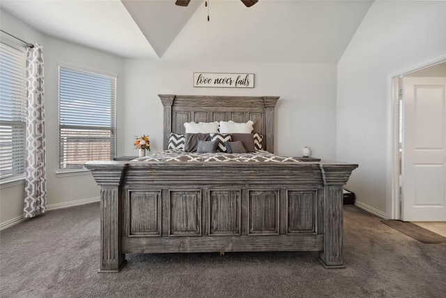 bedroom with baseboards, dark colored carpet, and lofted ceiling