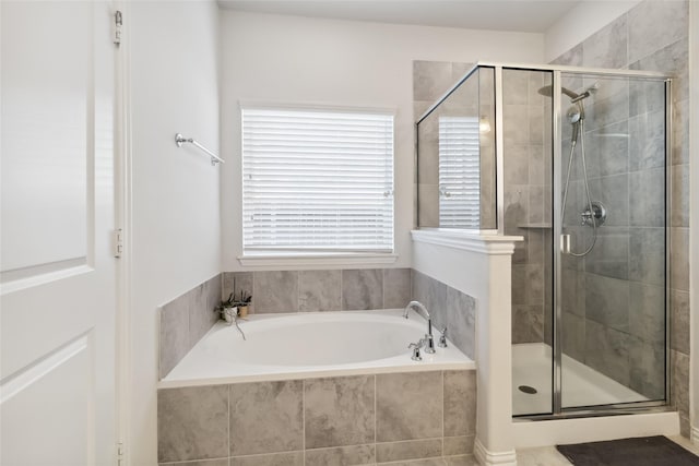 full bath featuring a garden tub and a stall shower