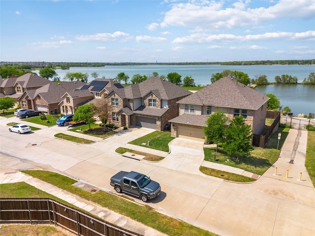 aerial view with a water view and a residential view