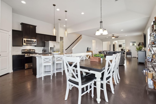 dining room featuring dark wood-type flooring, visible vents, a ceiling fan, and recessed lighting