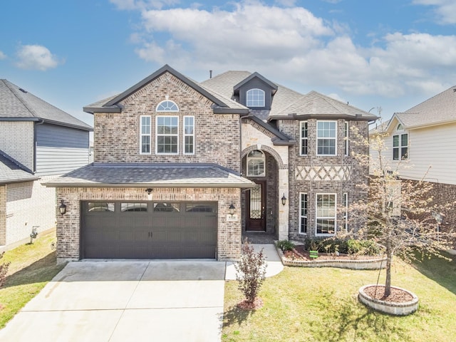 view of front of house with concrete driveway, a front yard, brick siding, and an attached garage