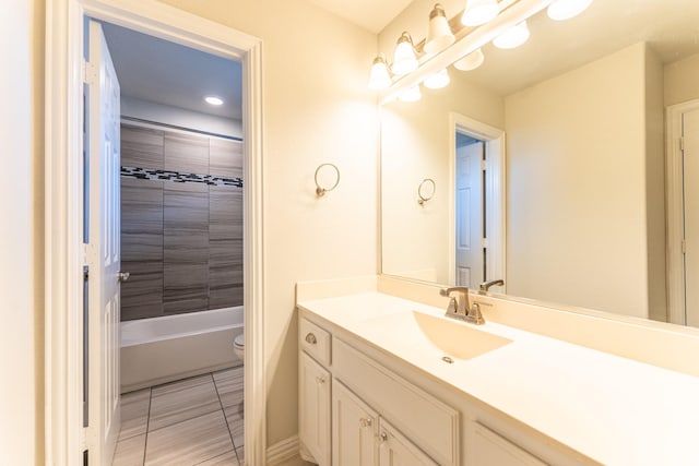 full bath featuring toilet, vanity, tile patterned flooring, and shower / washtub combination