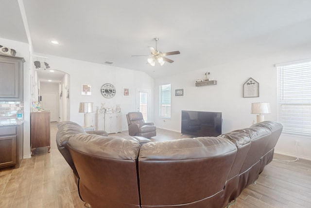 2821 Journey Ln, Forney, TX 75126 - living room with ceiling fan, light wood-type flooring, arched walkways, baseboards, and recessed lighting