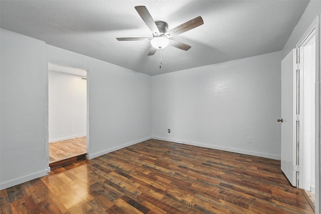 2306 Lavon Creek Ln, Arlington, TX 76006 - unfurnished bedroom featuring baseboards, a textured ceiling, ceiling fan, and dark wood-style floors