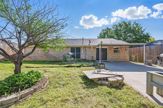 2306 Lavon Creek Ln, Arlington, TX 76006 - rear view of property with brick siding, fence, a lawn, and a patio area