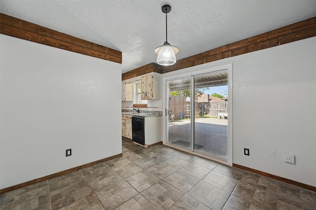 2306 Lavon Creek Ln, Arlington, TX 76006 - unfurnished dining area featuring a textured ceiling, baseboards, and stone finish flooring
