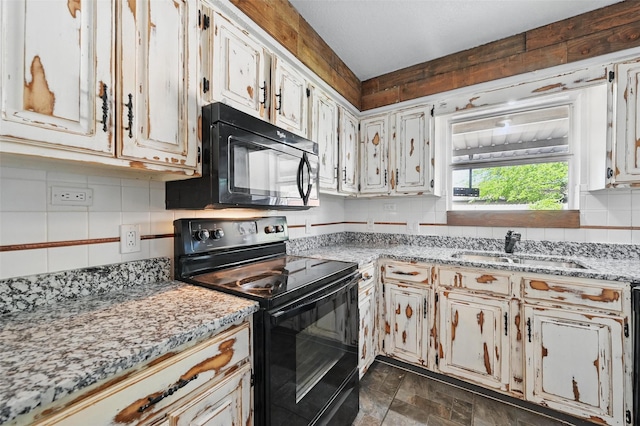 2306 Lavon Creek Ln, Arlington, TX 76006 - kitchen with a sink, black appliances, backsplash, light stone counters, and stone finish flooring