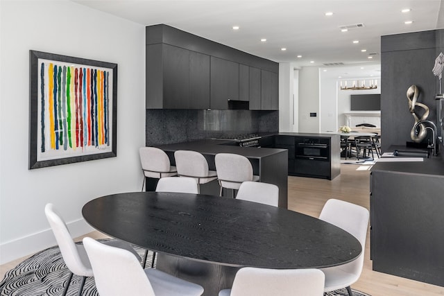 4416 Livingston Ave, Highland Park, TX 75205 - dining area featuring light wood-style flooring, a notable chandelier, visible vents, and recessed lighting