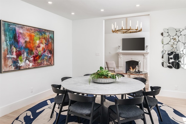 4416 Livingston Ave, Highland Park, TX 75205 - dining room featuring a fireplace, baseboards, light wood-type flooring, and recessed lighting