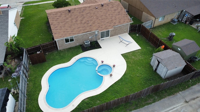5540 Rutledge Dr, The Colony, TX 75056 - view of pool with a yard, central air condition unit, a patio, and a fenced backyard
