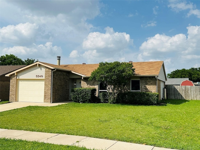 5540 Rutledge Dr, The Colony, TX 75056 - view of front of property with concrete driveway, an attached garage, fence, brick siding, and a front lawn
