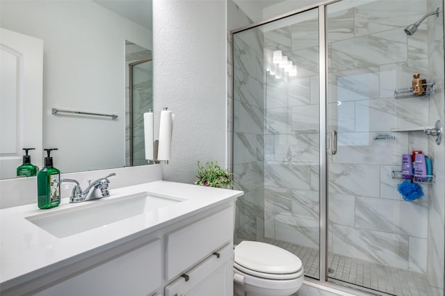 2702 Middleton Dr, Melissa, TX 75454 - bathroom featuring a shower stall, vanity, a textured wall, and toilet