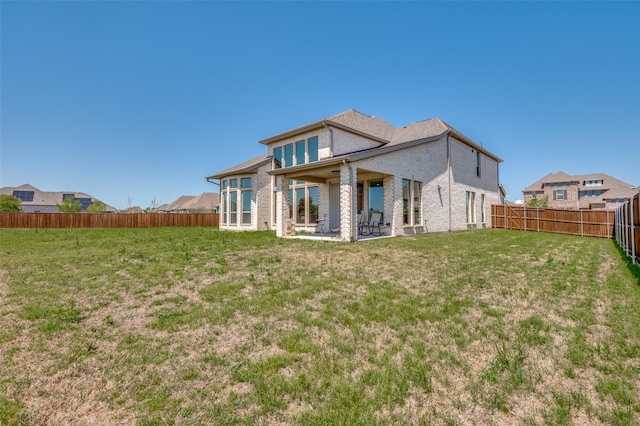 2702 Middleton Dr, Melissa, TX 75454 - back of house featuring brick siding, a fenced backyard, a patio, and a lawn
