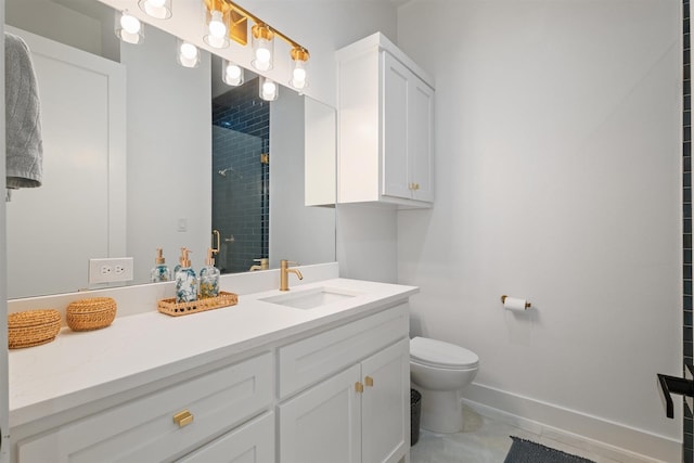 bathroom featuring a shower stall, tile patterned floors, toilet, vanity, and baseboards