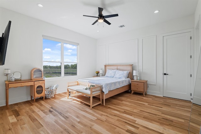 bedroom with recessed lighting, light wood-type flooring, and visible vents