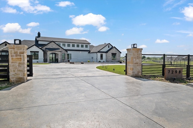 view of front of house with fence