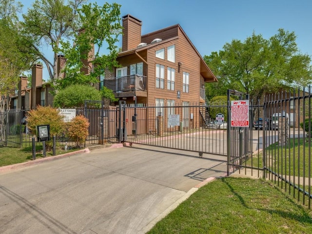 view of gate featuring fence