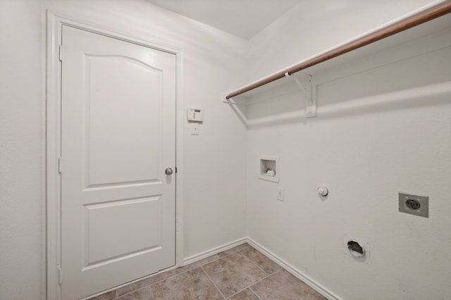 laundry area with laundry area, electric dryer hookup, washer hookup, gas dryer hookup, and baseboards