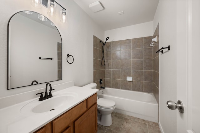 bathroom with tile patterned floors, toilet, vanity, and shower / bathtub combination