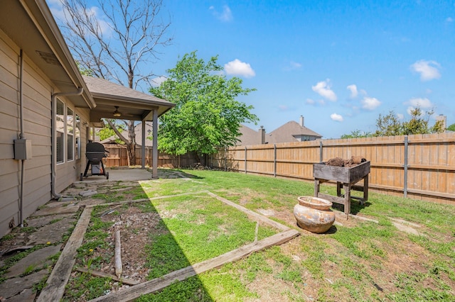 view of yard with a patio and a fenced backyard