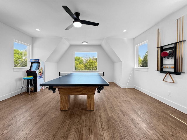 game room featuring baseboards, wood finished floors, and a wealth of natural light