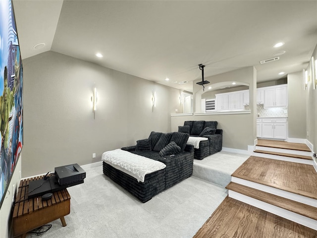 cinema with recessed lighting, baseboards, visible vents, and light wood-style floors