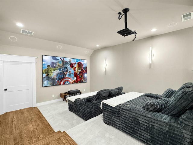 cinema room featuring visible vents, recessed lighting, baseboards, and wood finished floors
