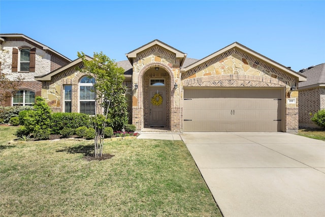 view of front of property with an attached garage, driveway, a front yard, and brick siding