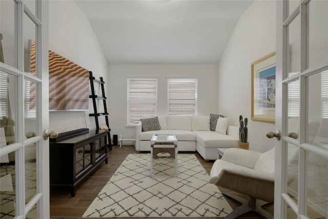 living room featuring dark wood-type flooring, baseboards, and vaulted ceiling