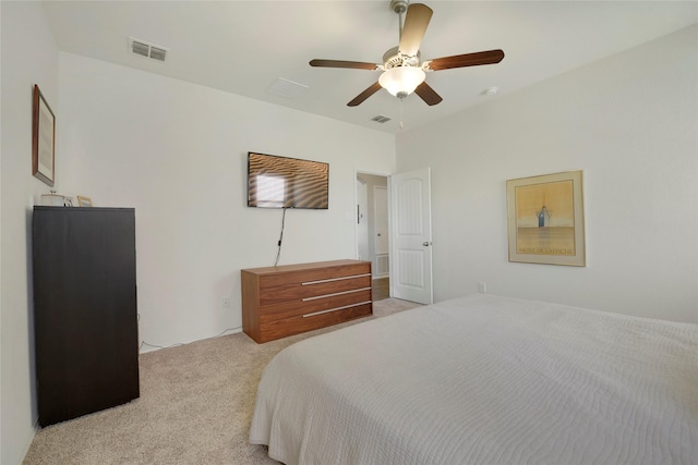 bedroom featuring light colored carpet, ceiling fan, and visible vents
